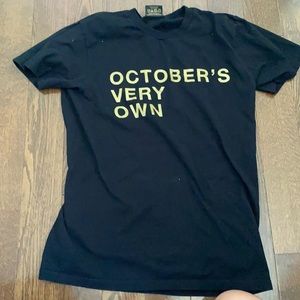 Black t shirt with gold writing on it
